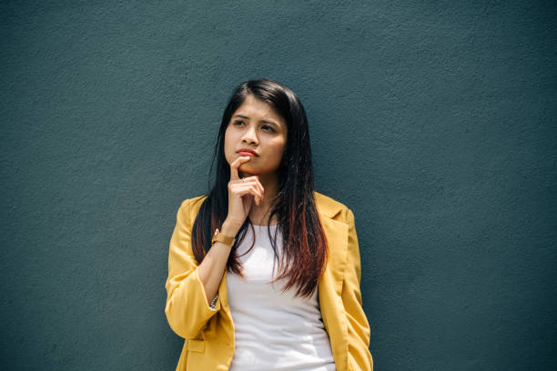 istock Portrait of Young Women with Thinking Expression 1190203708