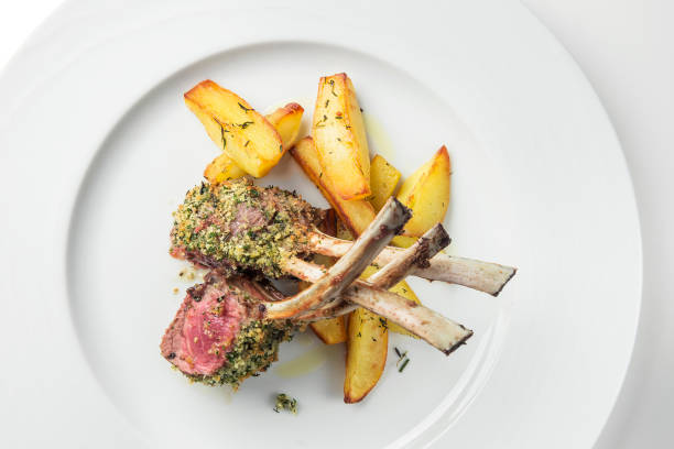 istock Rack of lamb with herbs and roast potatoes 1190203732
