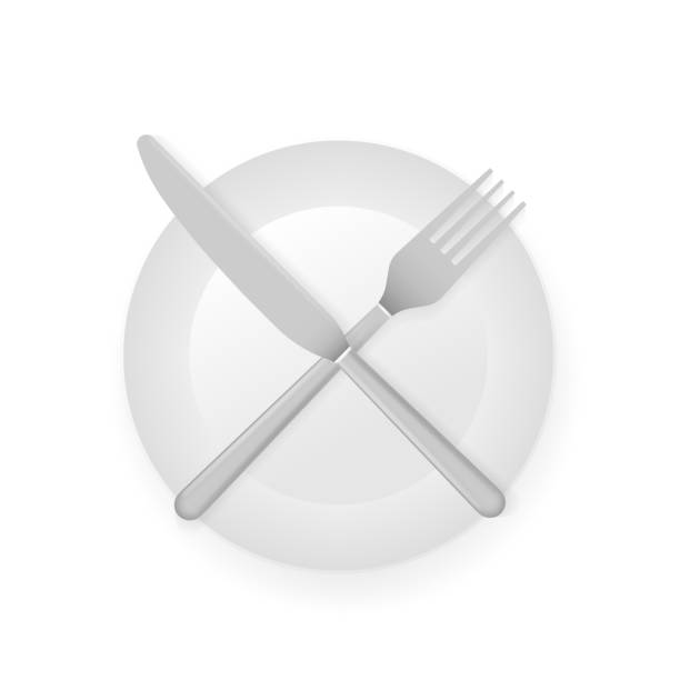 istock Intermittent fasting concept with knife and fork on white plate showing, cross symbol. 1190206646