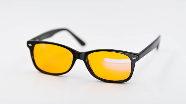 istock Blue light blocking glasses with yellow lenses and modern trendy stile on white background 1190208296