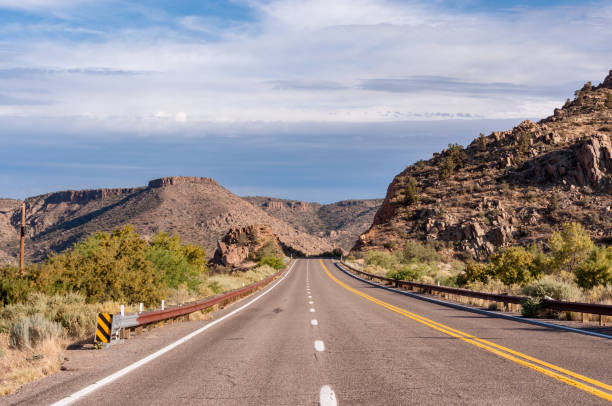 istock Road between hills, Arizona USA 1190209357