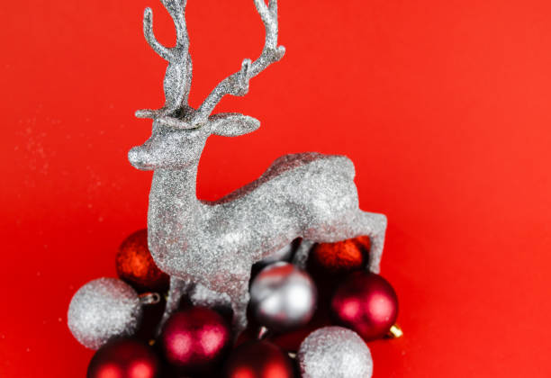 istock Silver glittered covered decorative hanging Christmas tree ornament with a mirrored internal. 1190209647