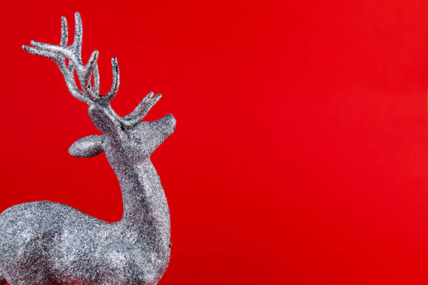 istock A reindeer shaped Christmas ornament covered with silver glitter. 1190209816