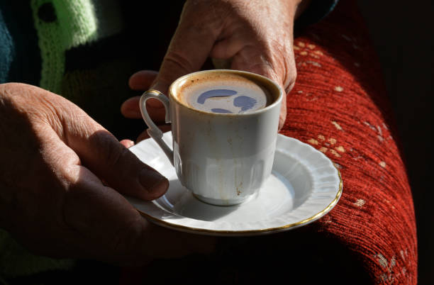 istock hands holding a cup of coffee 1190210798