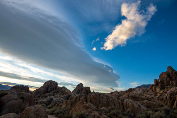 istock Sierra Wave lenticular cloud formation over desert rock landscape 1190210869