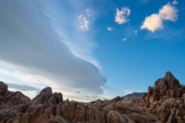 istock Sierra Wave lenticular cloud formation over desert rock landscape 1190211103