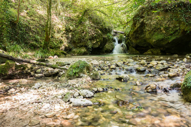 Valley of the Alento river in Serramonacesca (Italy): small lake and waterfall in a wild environment Valley of the Alento river in Serramonacesca (Italy): small lake and waterfall in a wild environment chieti stock pictures, royalty-free photos & images
