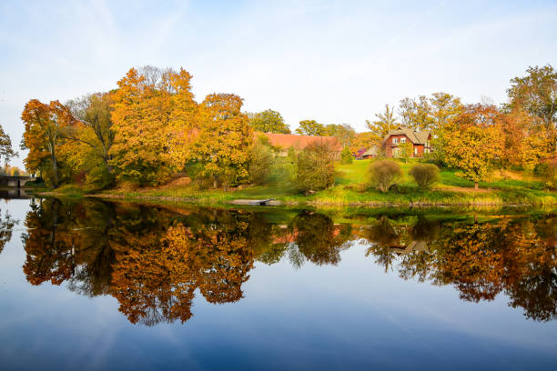 istock Pond in the fall and trees with golden foliage. 1190211363