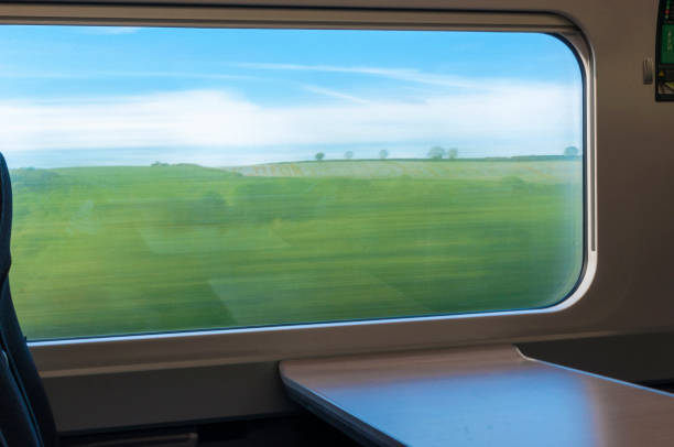 abstract landscape from a train window in motion - local train imagens e fotografias de stock