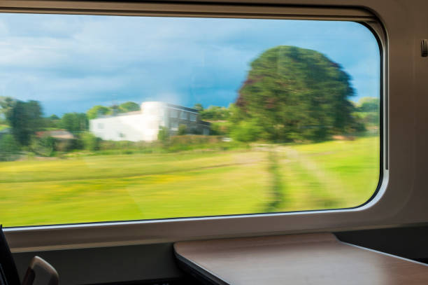 istock Blurred abstract landscape from a train window in motion 1190212392