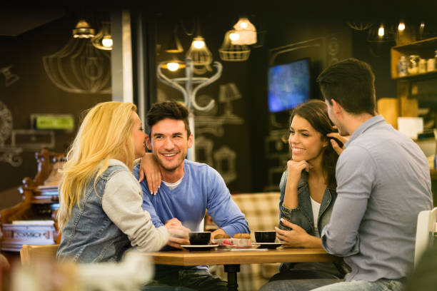 istock Two lovely couples chatting with each other in a cafe 1190212445