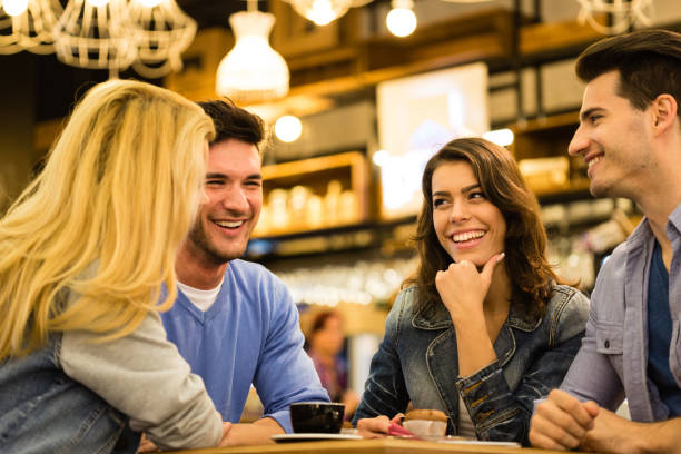 istock Small group of young adults socializing in a cafe 1190212456