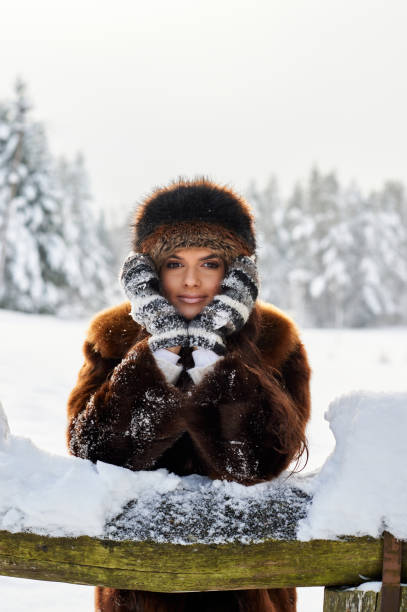 istock Young girl enjoying snow outdoors in winter. 1190212740