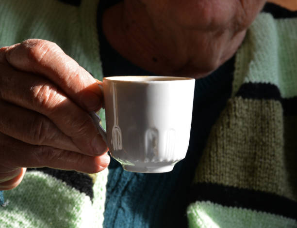 istock hands holding a cup of coffee 1190214171