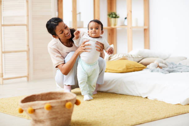 istock Mother learning her baby to go 1190214276