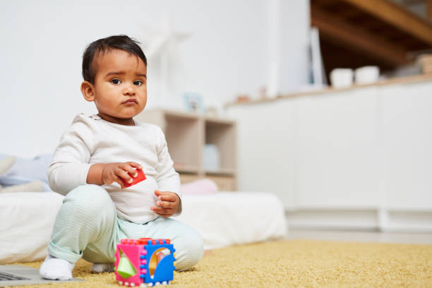 istock Cute baby playing at home 1190214351