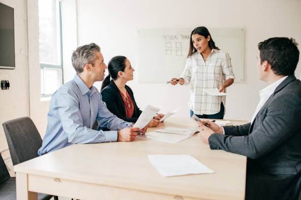 istock Business people in a boardroom 1190216739