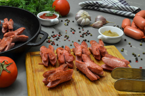 istock Grilled mini sausages. Mini sausages in a pan. 1190221115