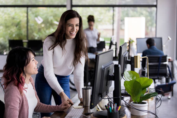 istock cheerfl businesswomen working together 1190223231