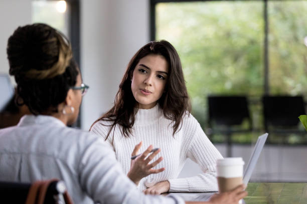 istock Businesswomen working on project together 1190223251