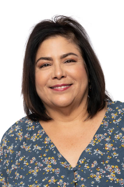 istock Mature woman posing looking at the camera smiling (real latino women) 1190224623