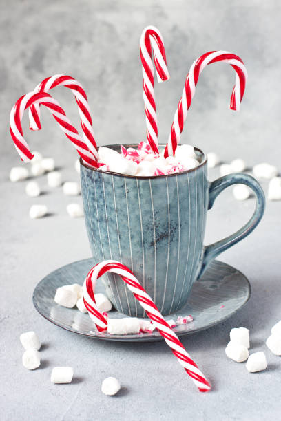 istock Christmas time composition with  sweet candy canes and  marshmallow in mug 1190224826