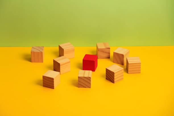 istock Wooden blocks on green background 1190232180