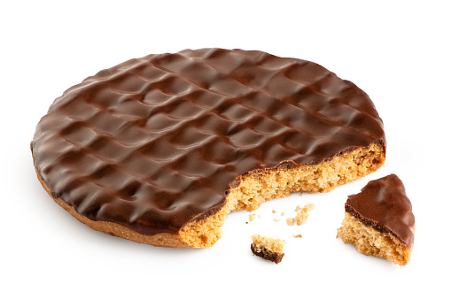 Dark chocolate coated digestive biscuit isolated on white. Partially eaten with crumbs.