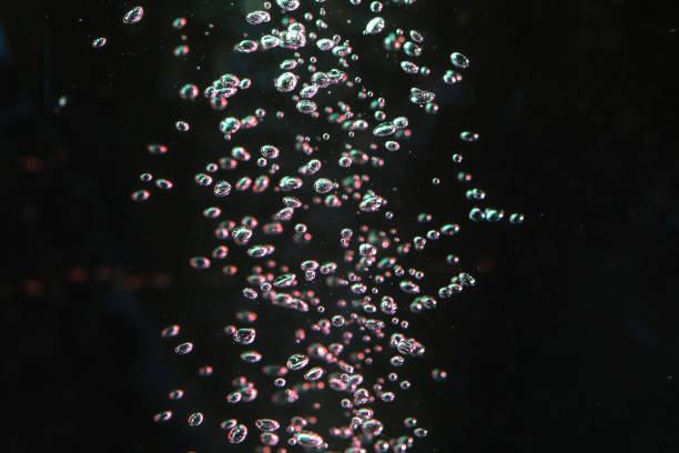 istock air bubbles in a black background 1190233917