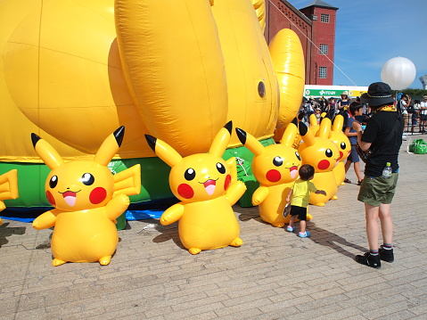 Yokohama, Kanagawa, Japan - August 6th, 2019: Giant inflatable Pikachu at the Pikachu Outbreak! 2019 event, an annual festival held in Yokohama Minato Mirai area. Pikachu is a fictional creature from Pokemon, a popular video game series.