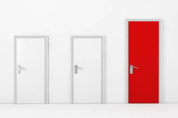 istock Three Business Office Doors, with One Big, Main and Red in Front of Wall. 3d Rendering 1190239330