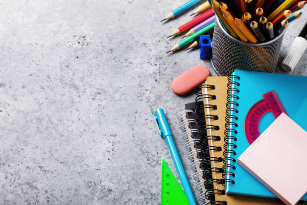 istock Different supplies for schoolchildren and students on the table with copy space. Top view on pencils, notebooks and rulers 1190241319