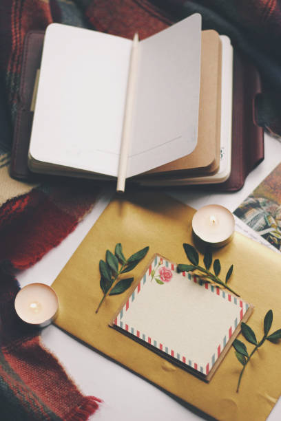 istock Opened book and leaves, postcard, autumn home comfort 1190241786