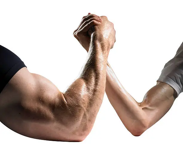 Arm wrestle betwen big muscly man and a small weak man