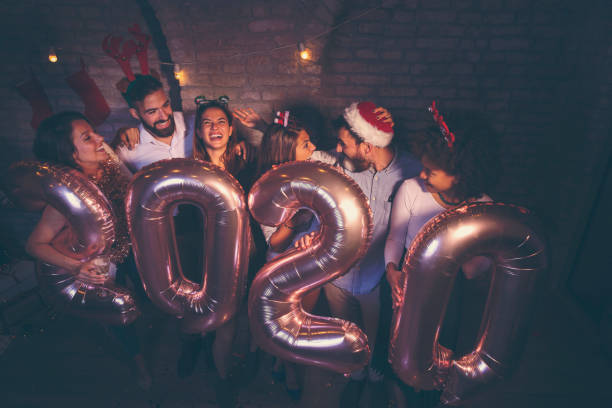 istock Friends having fun at New Years party 1190243382