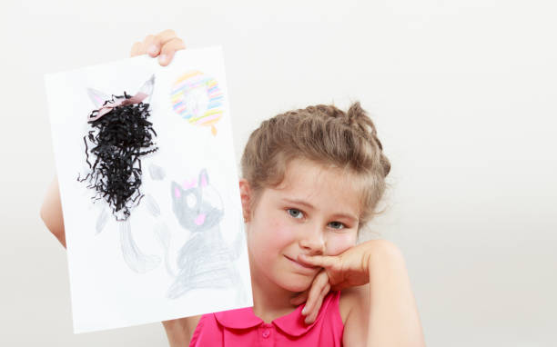istock Little girl draw in the classroom 1190245319