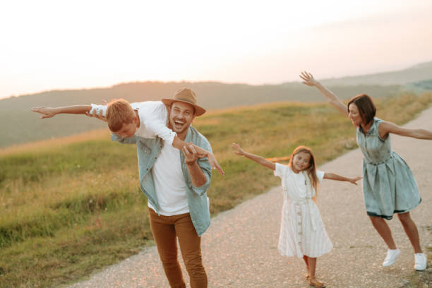istock Happy smiling family spending summer day at park. 1190246640