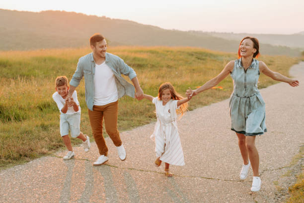 istock Happy smiling family spending summer day at park. 1190246651