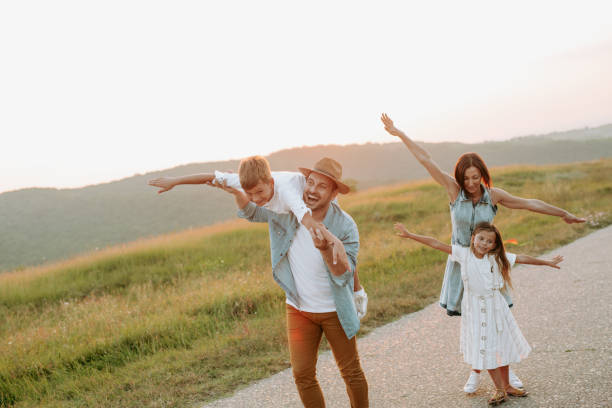 istock Happy smiling family spending summer day at park. 1190246652