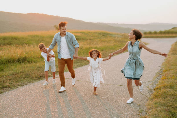 istock Happy smiling family spending summer day at park. 1190246662
