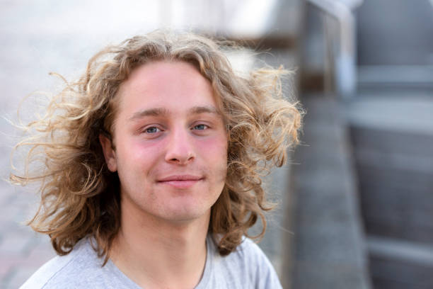 istock Portrait of modern 21 years old young man, background with copy space 1190247325