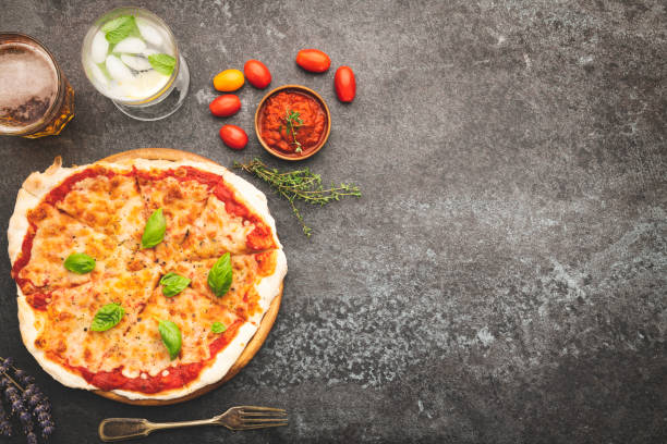 istock Italian Pizza On Black Concrete Background 1190252518