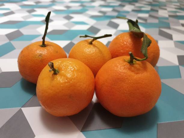 istock Clementines on a blue and gray background 1190253585