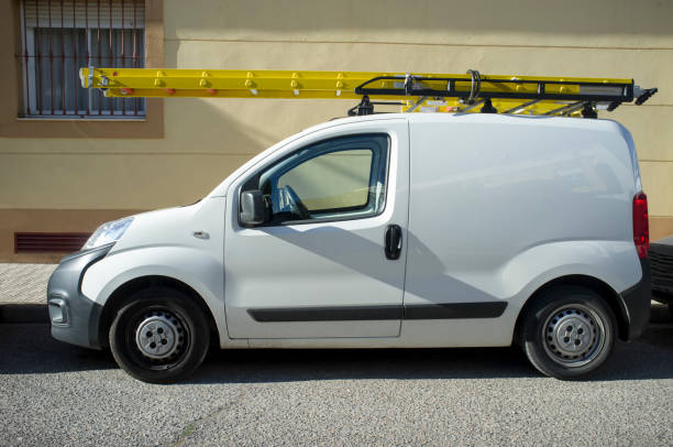 istock Delivery van loaded with yellow ladders 1190255367