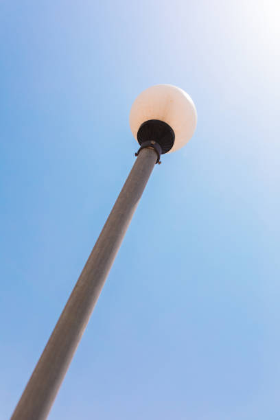 istock Round circle street light lamp pole under the blue sky. 1190256509