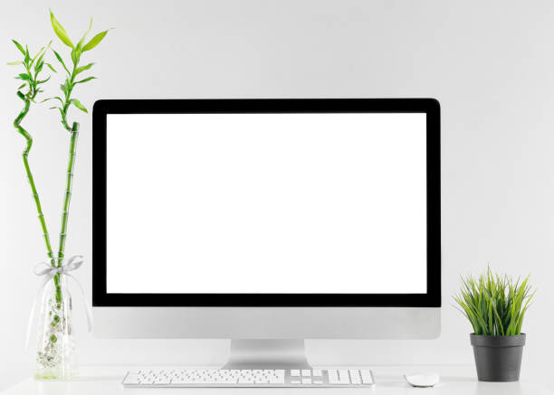 Computer all in one in office table with isolated white screen stock photo