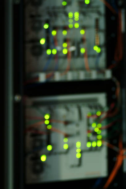 lit up server room hintergrund - cable network server network connection plug green stock-fotos und bilder