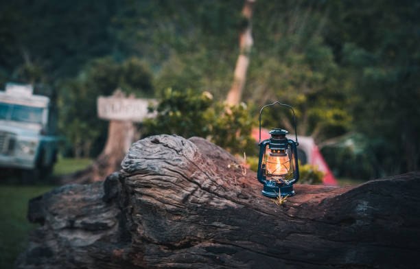 Man camping outdoors is pumping gas lamp