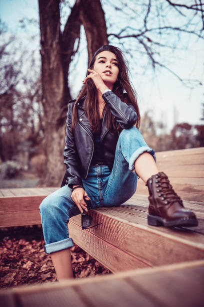 istock Beautiful Female Relaxing In Park During Autumn 1190264535