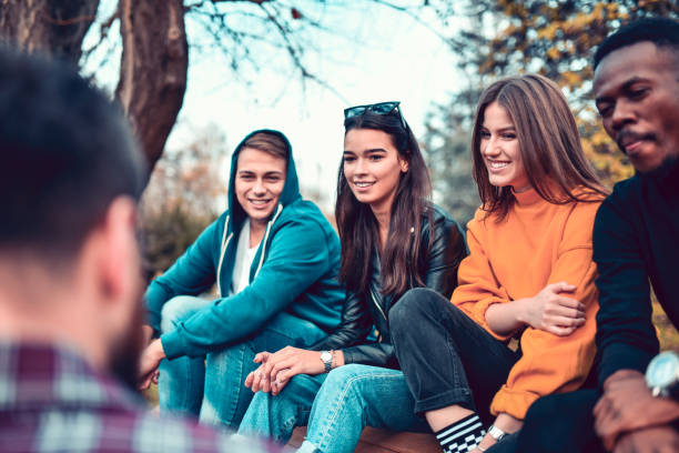 istock Friends Enjoying Sunny Autumn In Park 1190264666